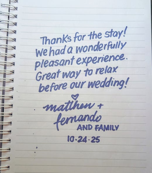 A note reading Thanks for the stay we had a wonderfully pleasant experience. Great way to relax before our wedding.